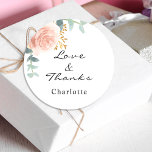 Rose gold pink floral eucalyptus thank you classic round sticker<br><div class="desc">A stylish white background. Decorated with green watercolored rose gold and blush pink floral,  rose,  eucalyptus leaves,  sprigs,  greenery,  faux gold leaves.  Personalise and add a name.  With the text: Love & Thanks.  
Perfect for birthday favours,  a bridal shower or baby shower.</div>