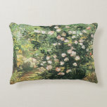 Rosebush in Blossom by Vincent van Gogh Decorative Cushion<br><div class="desc">Rosebush in Blossom by Vincent van Gogh is a vintage fine art post impressionism floral nature painting featuring a rose bush with beautiful blooming flowers in a garden. About the artist: Vincent Willem van Gogh (1853 -1890) was one of the most famous Post Impressionist painters of his era. His work...</div>