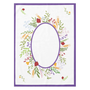 Rosh Hashanah Colourful Oval Floral Wreath on Whit Tablecloth