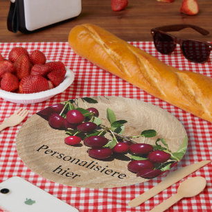 rote frische kirschen auf einem holzbrett paper plate