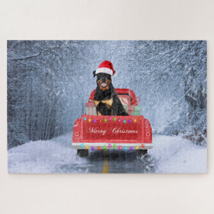 Rottweiler Dog in Snow sitting in Christmas Truck Jigsaw Puzzle
