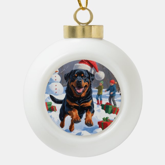 Rottweiler Running in Snow with Christmas Hat Ceramic Ball Christmas Ornament (Front)