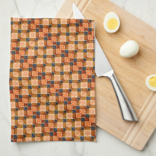 Rough orange chess parts forming new square shapes tea towel