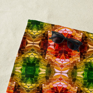 Round drawing generate red, green, and gold shapes beach towel