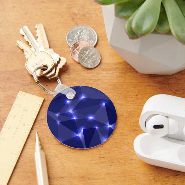 Round keychain featuring dark blue geometric shape (Desk)
