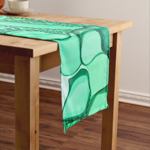 Round like stones in shades of light green to mint long table runner