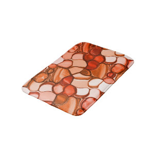 Round neven shapes like seeds, coral tones and red bath mat