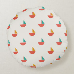 Round pillow with small sailboat pattern