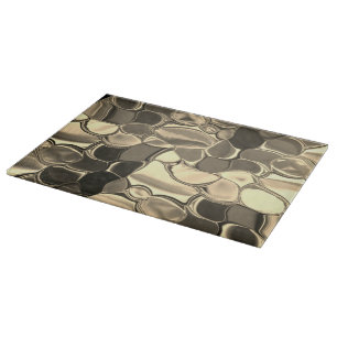 Rounded shapes in bronze colour, glossy light gold cutting board