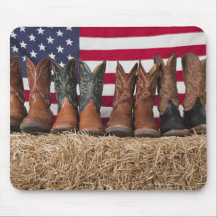 Row of cowboy boots on haystack mouse mat