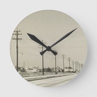 Row of Electricity Poles Round Clock