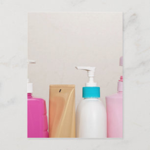 Row of toiletry bottles postcard