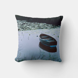 Rowboat on small lake surrounded by water cushion