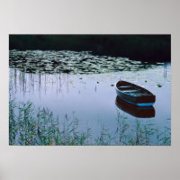Rowboat on small lake surrounded by water