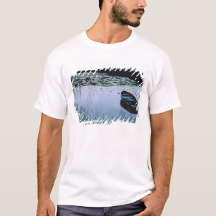 Rowboat on small lake surrounded by water T-Shirt