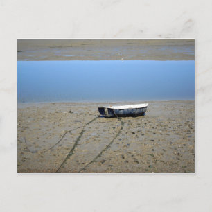 Rowing boat on the mudflat postcard