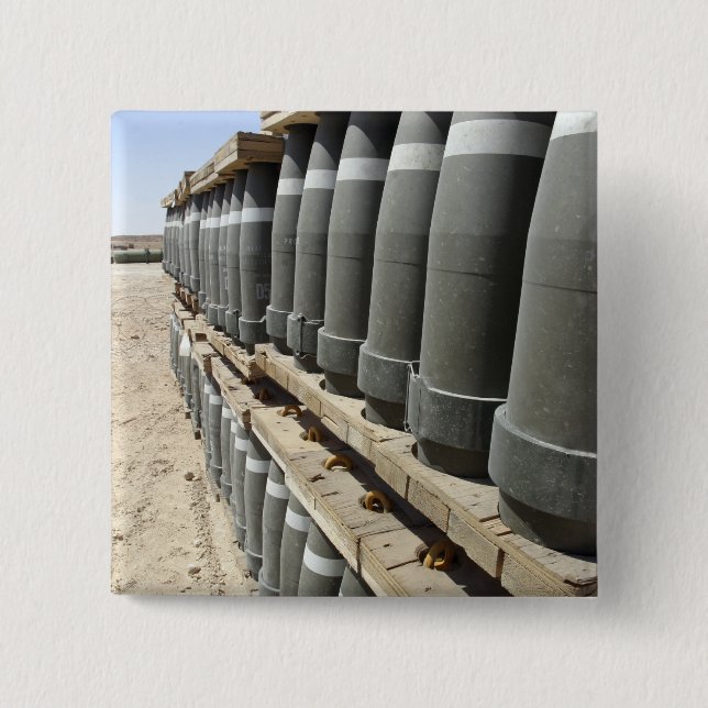 Rows of ammunition are stacked and prepped 15 cm square badge (Front)