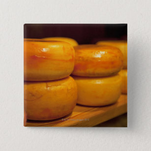 rows of colourful yellow Edam cheeses lined up 15 Cm Square Badge