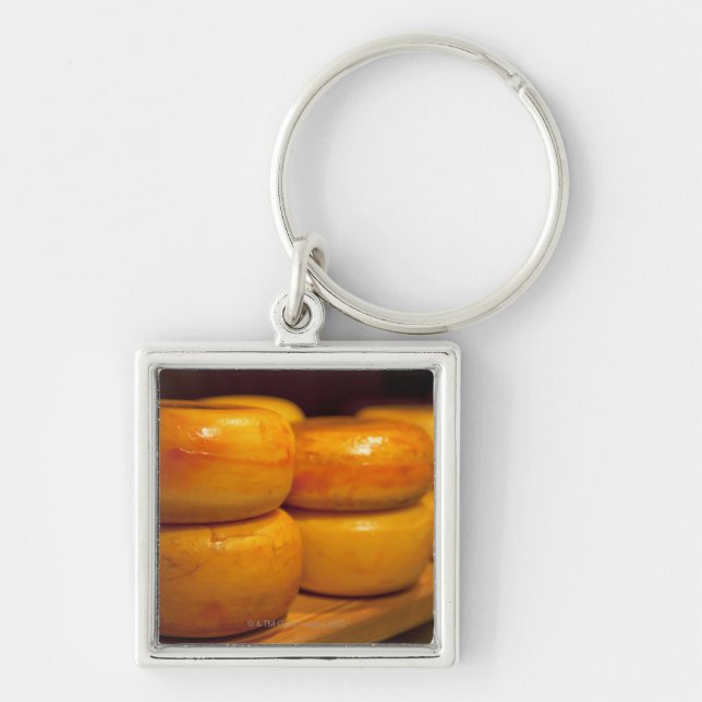 rows of colourful yellow Edam cheeses lined up Key Ring (Front)