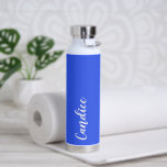 Royal Blue Personalised Wedding Bridesmaid Water Bottle<br><div class="desc">Gift your wedding bridesmaid or maid of honour with this trendy, vacuum Insulated water bottle that features her name in white, stylised script on a royal blue colour background designed to match your wedding colour scheme. Personalise bottle by editing and replacing name with your own as desired. Select your water...</div>