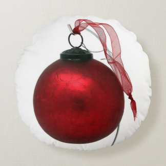 Ruby-red crackle glaze ornament with ribbon round cushion