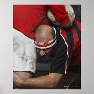 Rugby player tacking opponent, mid section poster