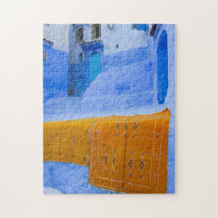 Rugs Draped On A Blue Wall Jigsaw Puzzle