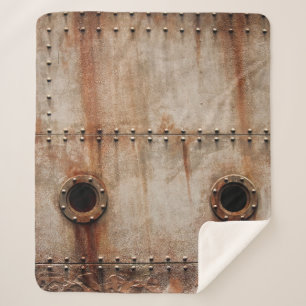 RUST AND TEXTURE ON METAL PLATE SIDES OF STAGED SH SHERPA BLANKET
