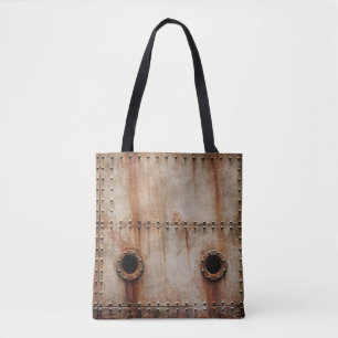 RUST AND TEXTURE ON METAL PLATE SIDES OF STAGED SH TOTE BAG