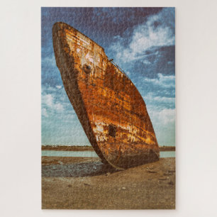 Rusted Shipwreck beached or stranded on a beach Jigsaw Puzzle