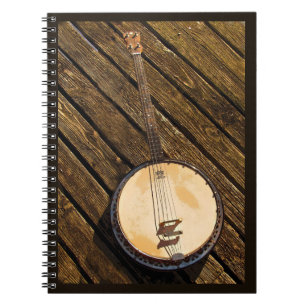 Rustic Banjo Music Instrument on Wood Notebook