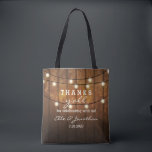 Rustic Barn Wood Country Wedding Thanks Y'All Tote Bag<br><div class="desc">Thank your out of town wedding guests with this personalised tote bag featuring a rustic design with twinkle string lights set against a barn wood background. Fun text reads "Thanks y'all" for celebrating with us! Personalise with 5 lines of custom text. Use as a thank you bag for bridesmaids, groomsmen,...</div>
