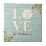Rustic Beach Sand Dollar Tile<br><div class="desc">A beach themed ceramic tile with the word love, and personalised with your name underneath. A sand dollar seashell creates the "o" in the word love. This coaster has a weathered textured wood background and the corners are decorated with sea grasses. This sand dollar ceramic tile is a great addition...</div>