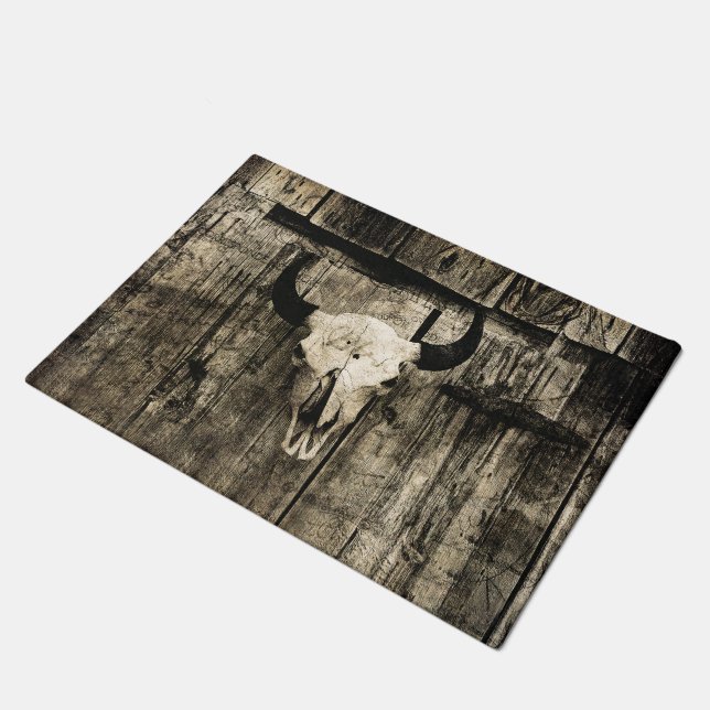 Rustic buffalo skull with horns on a barn doormat (Angled)