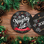 Rustic Chalkboard "On the Naughty List." Christmas Ceramic Tree Decoration<br><div class="desc">Add a touch of rustic charm to your holiday decor with this elegant chalkboard ornament. Handcrafted from flat circle MDF, it features the whimsical phrase "On the Naughty List. I Regret Nothing!" in matching typography on a black chalkboard background. Adorned with delicate white ivy leaves and festive red holly berries,...</div>