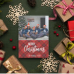 Rustic Country Plaid Merry Christmas Family Photo Holiday Card<br><div class="desc">Fun and festive, these photo cards are the best way to send warm wishes this holiday season. The design features a red, white, and black flannel pattern on the front with text "Merry Christmas" that can be changed and a place to put your family name and the year. The back...</div>