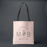 Rustic Floral Stem Wedding Monogram | Blush Tote Bag<br><div class="desc">Custom printed tote bags make a fun and functional wedding favour your guests will love! Personalise the template with the bride and groom's names or monogram initials. Add your wedding date, the city, state or venue name or any other custom text. This modern rustic logo-style design has a simple floral...</div>