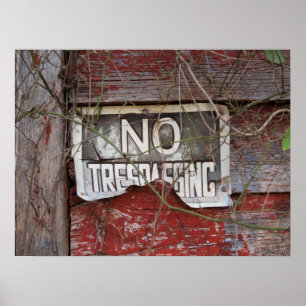 Rustic No Trespassing Sign on Red Barn