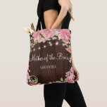 Rustic pink floral barn wood mother of the bride tote bag<br><div class="desc">Wedding personalised mother of the bride or groom, bridesmaid, maid of honour, matron of honour, or flower girl tote bag featuring a beautiful watercolor blush pink peony roses wreath and strings of twinkle lights on a dark brown barn wood-like background. Ideal for spring or summer garden outdoor rustic country, barn...</div>