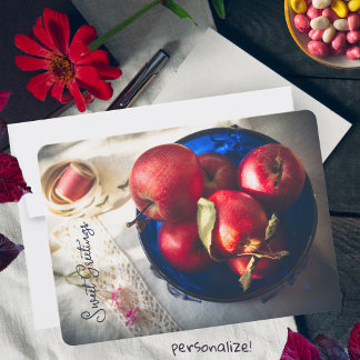 Rustic red apples, flowers, and ribbon holiday card