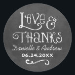 Rustic Script Love and Thanks Chalkboard Wedding Classic Round Sticker<br><div class="desc">Charming chalkboard favour stickers feature "Love & Thanks" with a custom wedding monogram in handwritten style fonts that have a white chalk appearance. Background has a rustic black board textured appearance.</div>