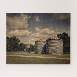 Rustic Silos in a Sleepy Scene Under Fluffy Clouds Jigsaw Puzzle
