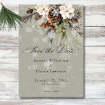 Rustic Snowfall Pine & White Floral Sage Wedding Save The Date<br><div class="desc">Envelop your guests in the serene beauty of winter with our exquisite wedding save the date card. A calming dusty sage backdrop creates a peaceful canvas for a stunning arrangement of fresh green pine sprigs, soft cream-coloured blooms, and rustic brown pinecones. This natural masterpiece is adorned with a delicate snowfall...</div>
