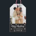 Rustic Snowflake Chalkboard Photo Christmas  Gift Tags<br><div class="desc">Rustic Chalkboard Snowflakes Family Photo Christmas Gift Tags. Featuring a single photo with 'Merry Christmas' calligraphy and your family name and year on black chalkboard background. The rustic snowy, minimalist design adds a touch of sophistication to your holiday gifts, ensuring they stand out this season! The displayed family photo is...</div>