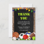 Rustic Sports Themed Kids Birthday Thank You Card<br><div class="desc">These birthday thank you cards are a game changer! Fun colourful sports themed, featuring a rustic wooden and black chalkboard background, decorated with tiny white stars, a rainbow banner, green grass and array of sports equiptment (football, volleyball, basketball, hockey puck, rugby ball, tennis ball, snooker ball, golf ball, and even...</div>