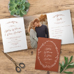Rustic Terracotta Wildflower Boho Photo Wedding Tri-Fold Invitation<br><div class="desc">This elegant tri-fold wedding invitation features rustic hand-drawn wildflower accents paired with elegant typography. The inside of the card features the invitation, one vertical photo, and an rsvp card that can be cut and mailed. The rsvp card requires standard first class postage (not postcard rate). On the back of the...</div>