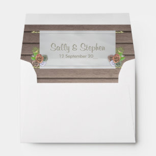 Rustic wood and floral wedding invitation envelopes