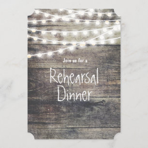 Rustic wood and string lights rehearsal dinner invitation
