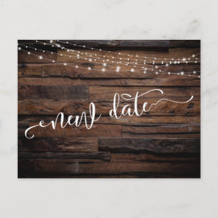 Rustic Wood & Lights Postponed Wedding New Date Postcard