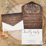 Rustic Wood Script Monogram Floral Wedding All In One Invitation<br><div class="desc">All in one wedding invitation featuring a hand-drawn floral garland and chic typography on a  rustic wood panels background. The invitation includes a perforated RSVP card that can be individually addressed or left blank for you to handwrite your guest's address details. Designed by Thisisnotme©</div>